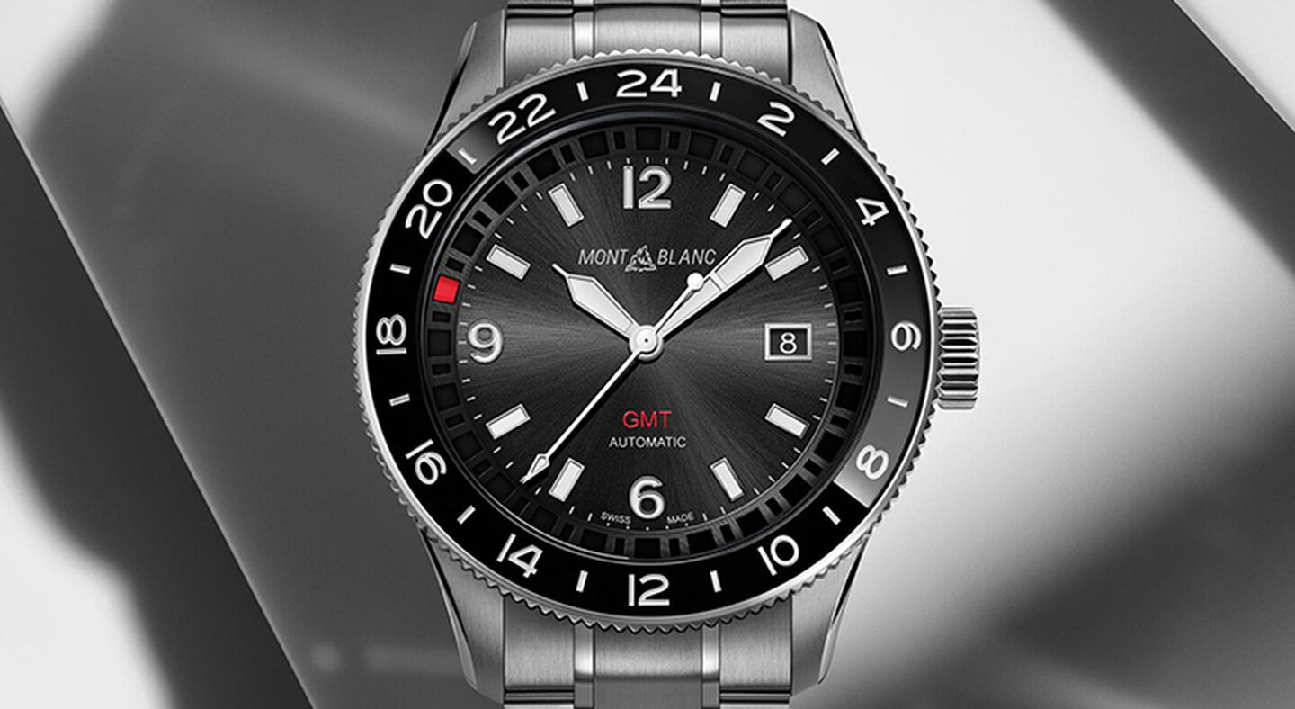 A Montblanc 1858 watch on a grey background.